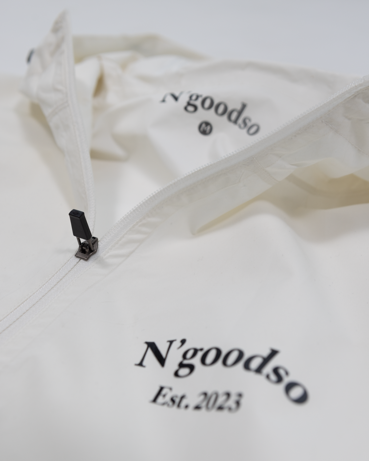 WHITE WINDBREAKER